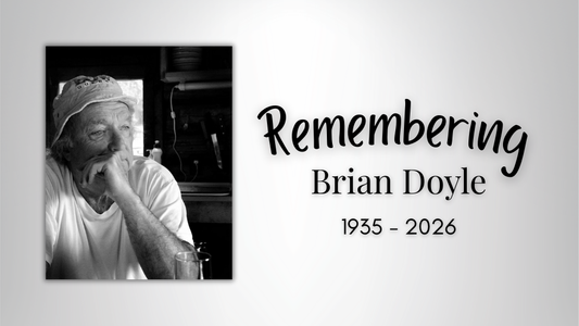 Digital graphic. Features a photo of author Brian Doyle. Text reads "Remembering Brian Doyle. 1935-2026."